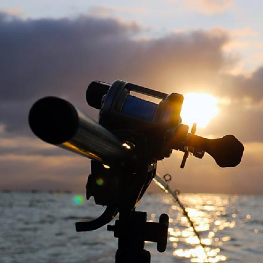 columbia river fishing guide rod as sun sets - dan ponciano